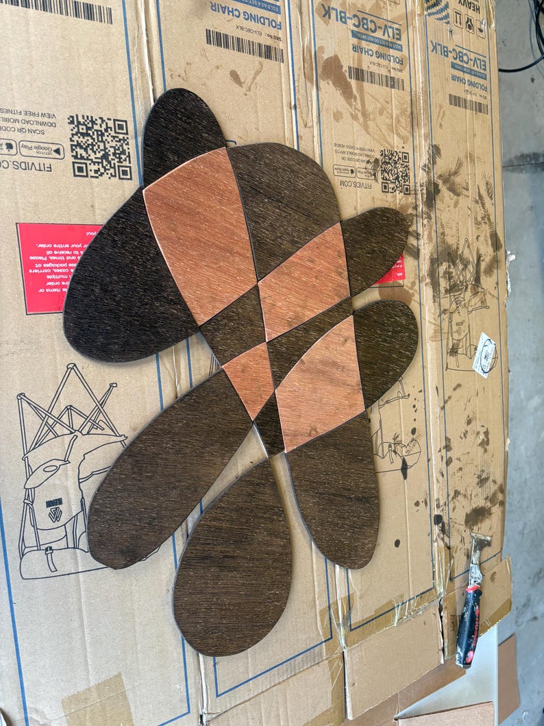 Stained piece in dark brown and copper drying in the workshop